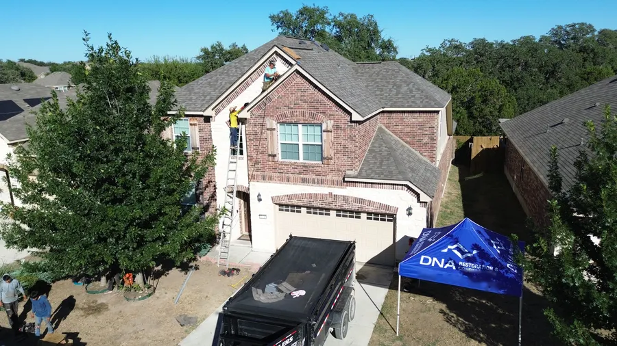DNA crew and dump trailer on site by DNA Restoration & Construction